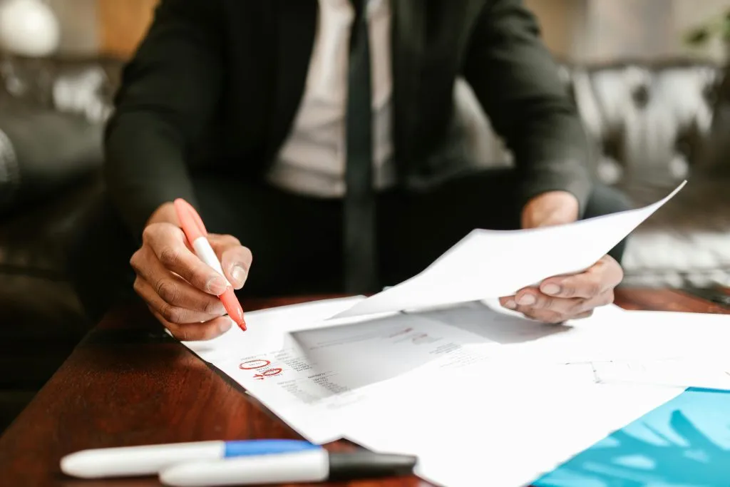 a man working with documents on table